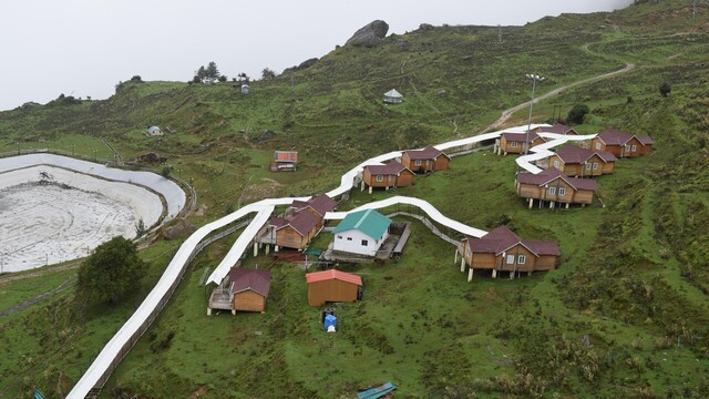 group of houses on a hill in auli