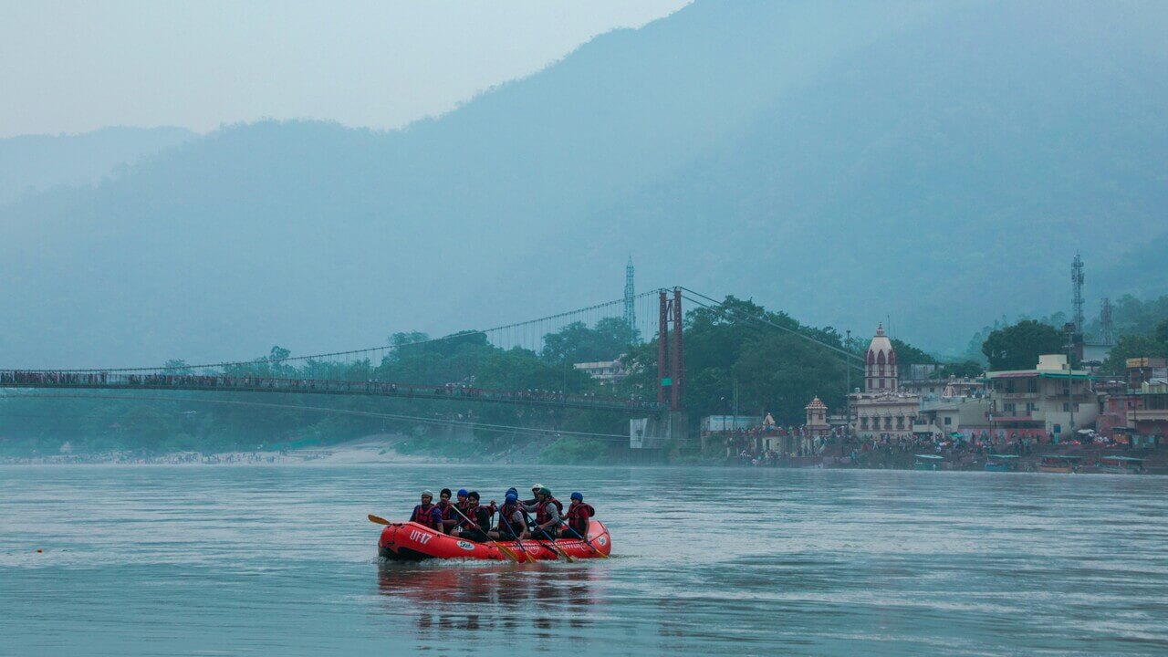 people rafting in river in rishikesh