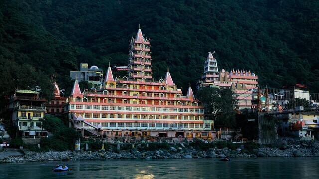 temple located close to river in rishikesh