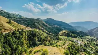 curvy road going through mountains in chakrata