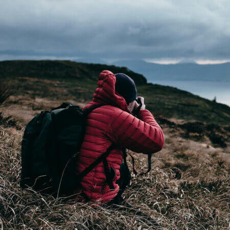 photographer clicking photo on a mountain